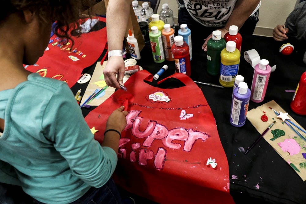 Volunteers help children make personalized capes during this year?s Albuquerque Comic Con at the Downtown Convention Center on Jan. 13, 2018.  
