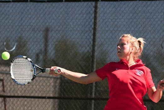 Senior Jennifer Ryba hits a forehand during her singles match on Saturday against BYU at the UNM Tennis Complex. UNM defeated BYU 4-3.