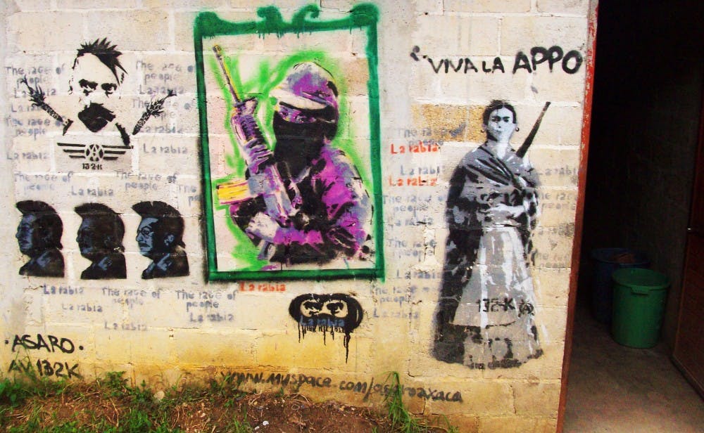 	Revolutionary graffiti is displayed on the wall of a student dormitory in Oventic, Chiapas.