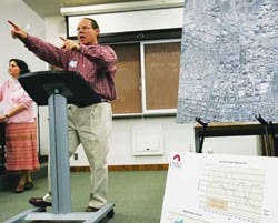 UNM President David Harris answers questions about the future of the North Golf Course on Sunday at the UNM School of Law.  
