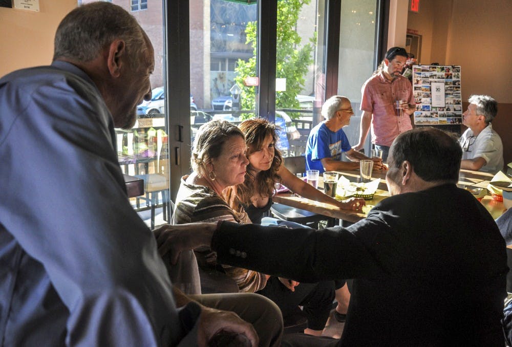 Lawyers and attendees of the ?Beer with a Barrister? event discuss environmental issues at The Monks? Corner Taproom on June 28, 2017. The event was hosted by the New Mexico Environmental Law Center.