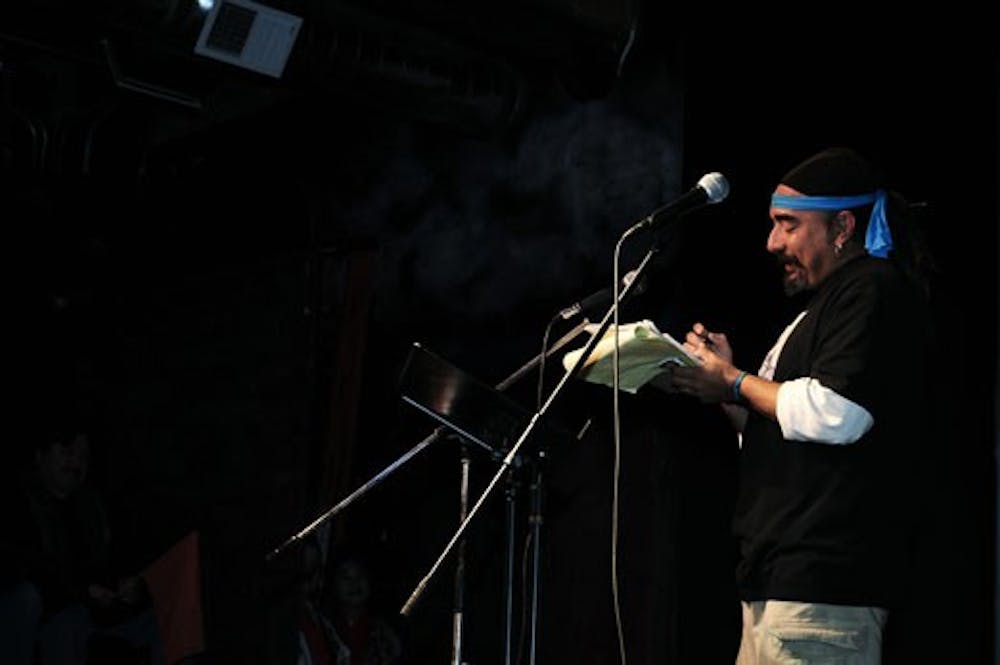 Haiku championship winner Danny Solis reads a poem at the Filling Station on Saturday.