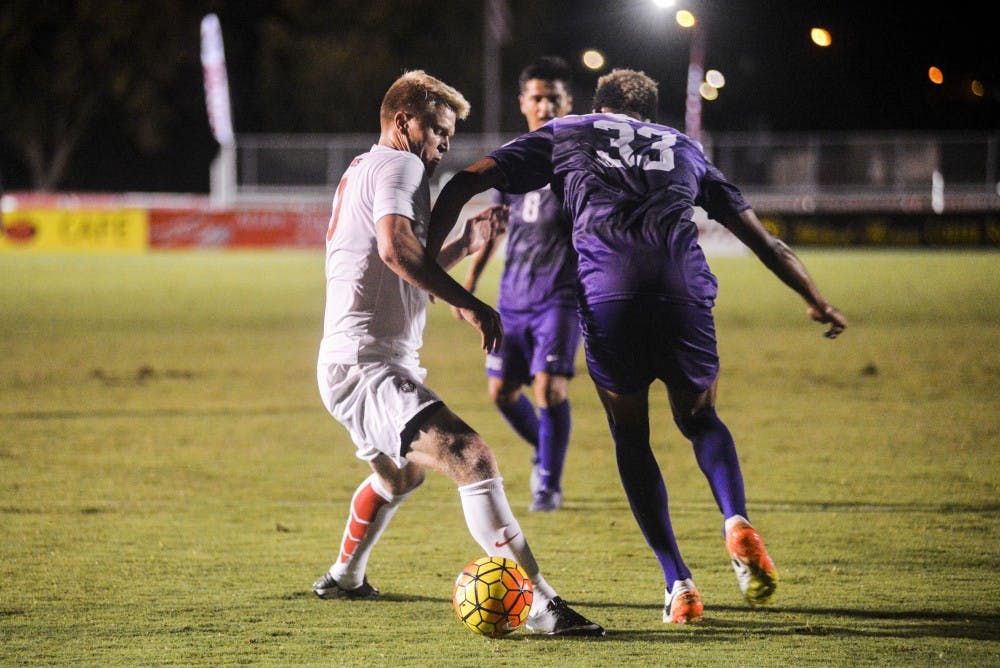 Junior forward Luke Lawrence fights off a Grand Canyon University player on Sunday, Sept. 11, 2016 at the UNM Soccer Complex. The Lobos begin Conference USA play this Sunday against Kentucky University.