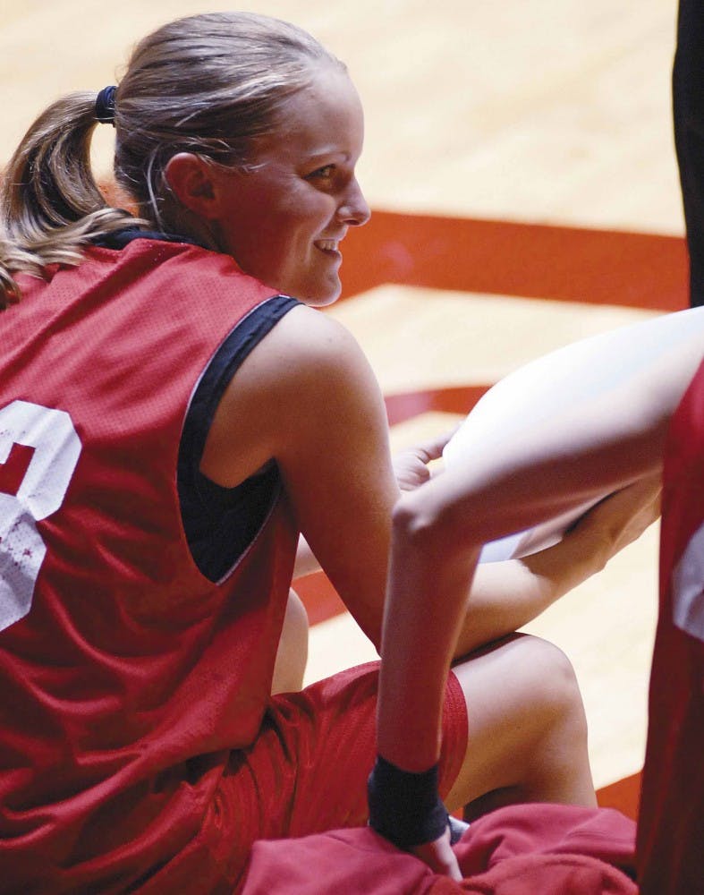 Senior point guard Katie Montgomery talks with teammates during a break in practice at The Pit on Tuesday.
