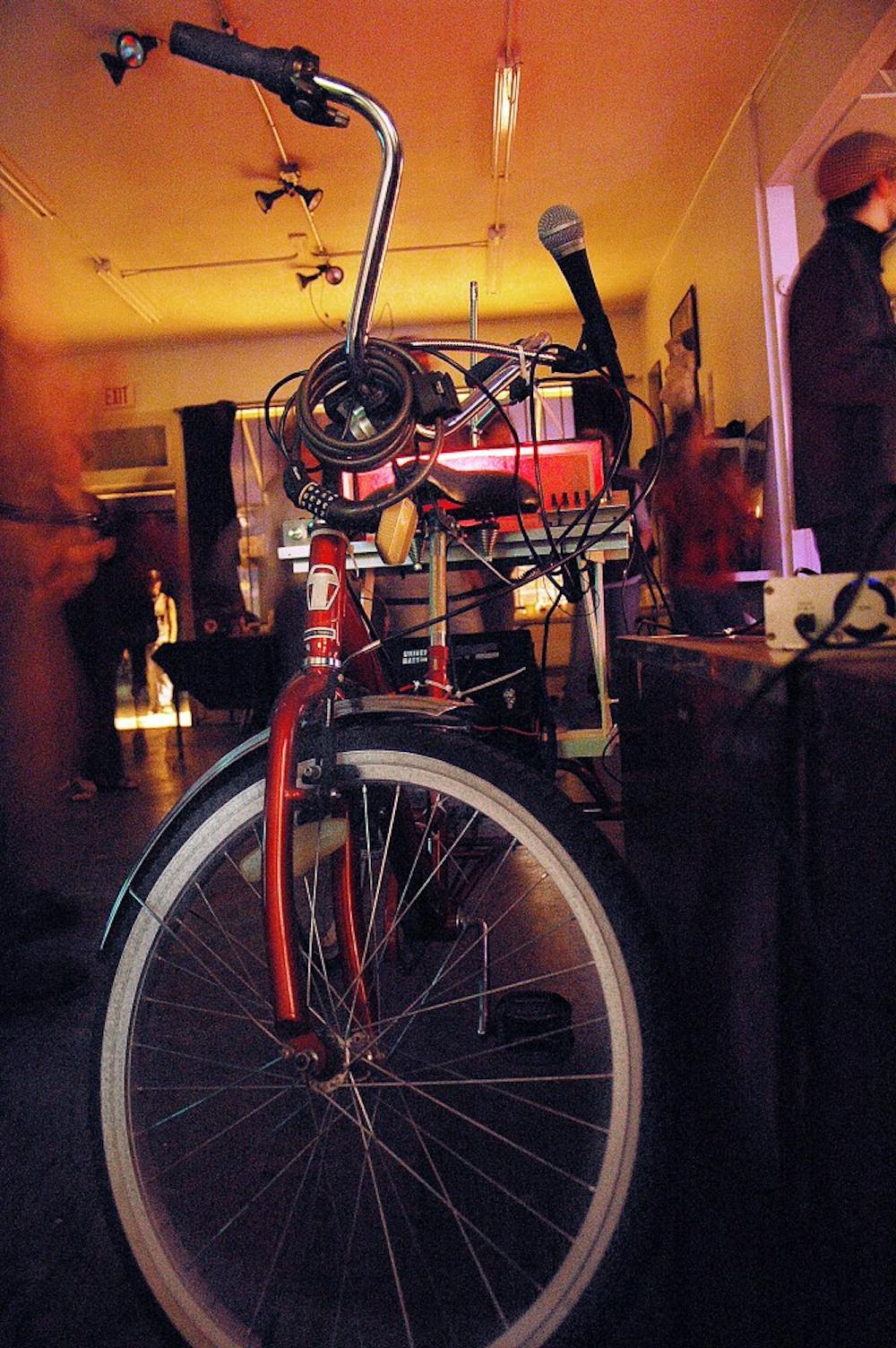 	Media arts tricycle crafted by students Seth Grant, Dylan Stevens-Sheri and Parker Jennings is displayed during a
show at Black Market Goods Gallery on Saturday. The tricycle has an FM transmitter which broadcasts its signal up to
a half-mile radius around the tricycle.