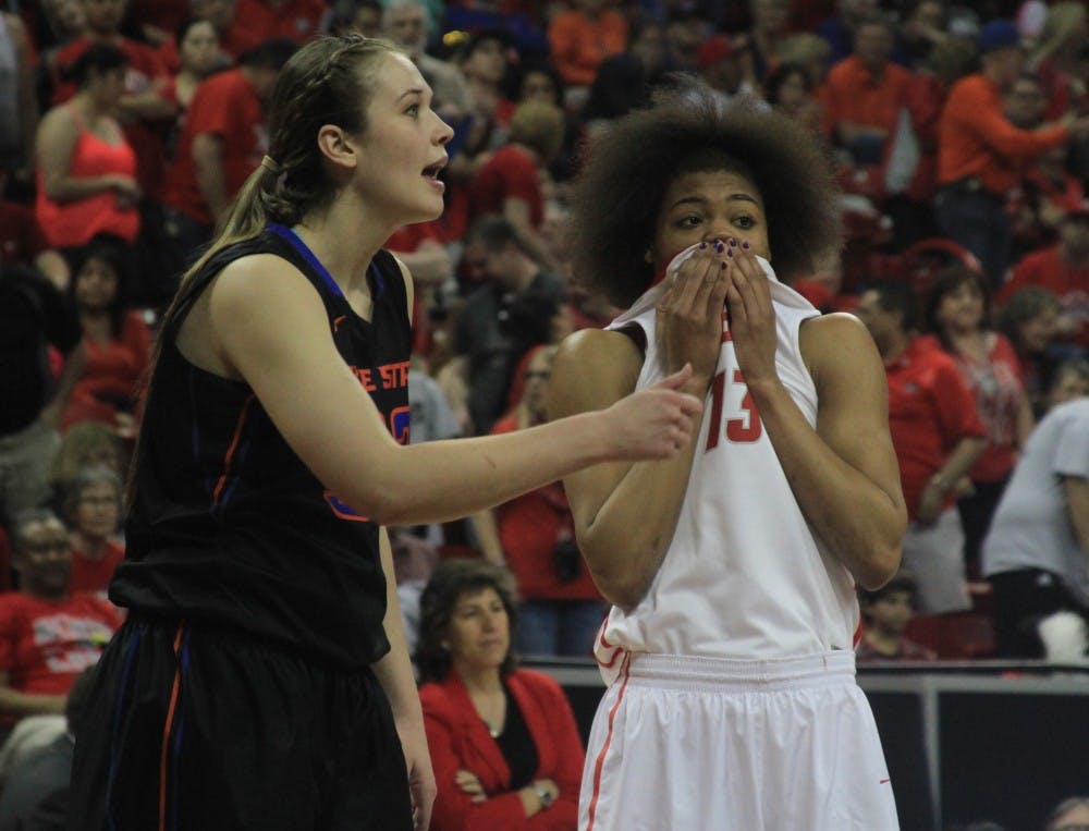 New Mexico’s Khadijah Shumpert wipes her face as she and Boise State’s Miquella Askew await a free throw attempt during the second half of the Mountain West Basketball Championship game Friday afternoon at the Thomas &amp; Mack Center in Las Vegas, Nevada. The Lobos lost 66-60.