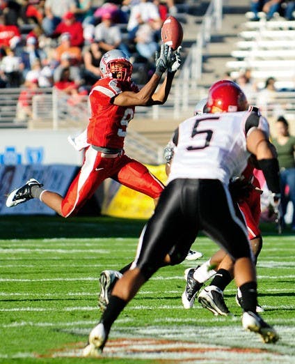 Wide receiver Michael Scarlett hauls in a pass against San Diego State on Saturday.  UNM routed the Aztecs 70-7. 