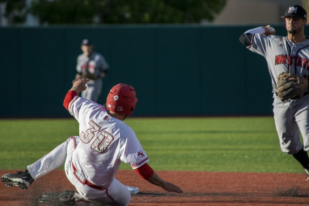 Sophomore Carl Stajduhar slides into second base Tuesday night at Santa Ana Star Field against the NMSU Aggies. UNM finished the evening by beating NMSU 10-4.&nbsp;