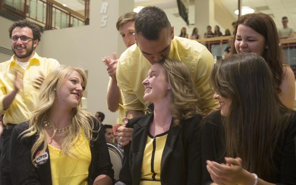 Jenna Hagengruber celebrates with members of her slate, Drive for ASUNM on Wednesday at SUB atrium. Hagengruber won the ASUNM presidential election against Go ASUNM slate candidate Mack Follingstad.
