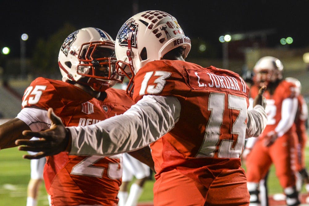 Senior Quarterback Lamar Jordan embraces a teammate after a touchdown against Nevada on Nov. 5, 2016. The UNM football team was named ?one of the most entertaining teams to watch? by Matt Brown of sportsonearth.com. 