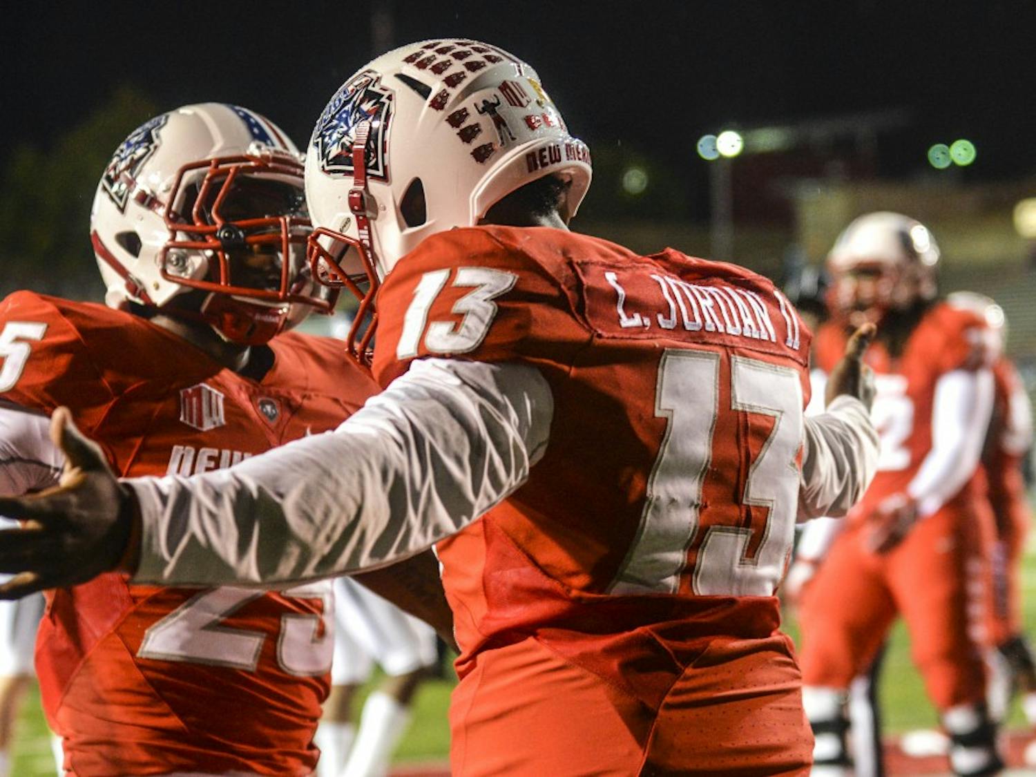 Senior Quarterback Lamar Jordan embraces a teammate after a touchdown against Nevada on Nov. 5, 2016. The UNM football team was named ?one of the most entertaining teams to watch? by Matt Brown of sportsonearth.com. 