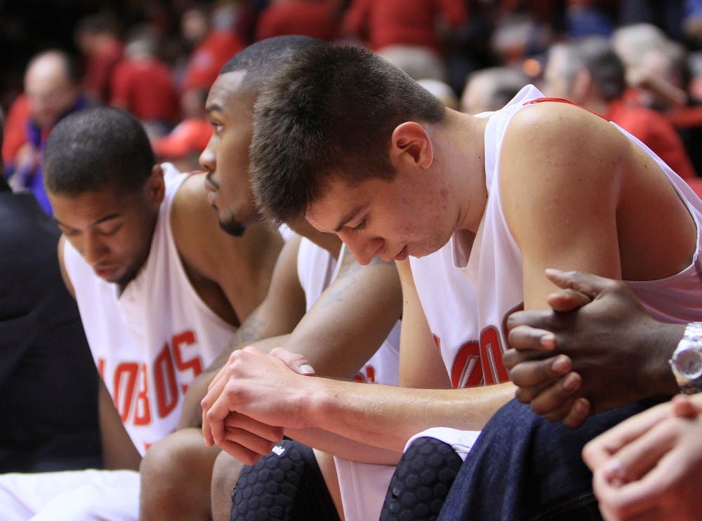 	Roman Martinez sits somberly on the bench during the Lobos’ 74-62 loss at The Pit to Mountain West Conference foe UNLV on Jan. 9. The Lobos started the season 14-1 overall, but have since dropped two consecutive games to San Diego State and the Runnin’ Rebels.