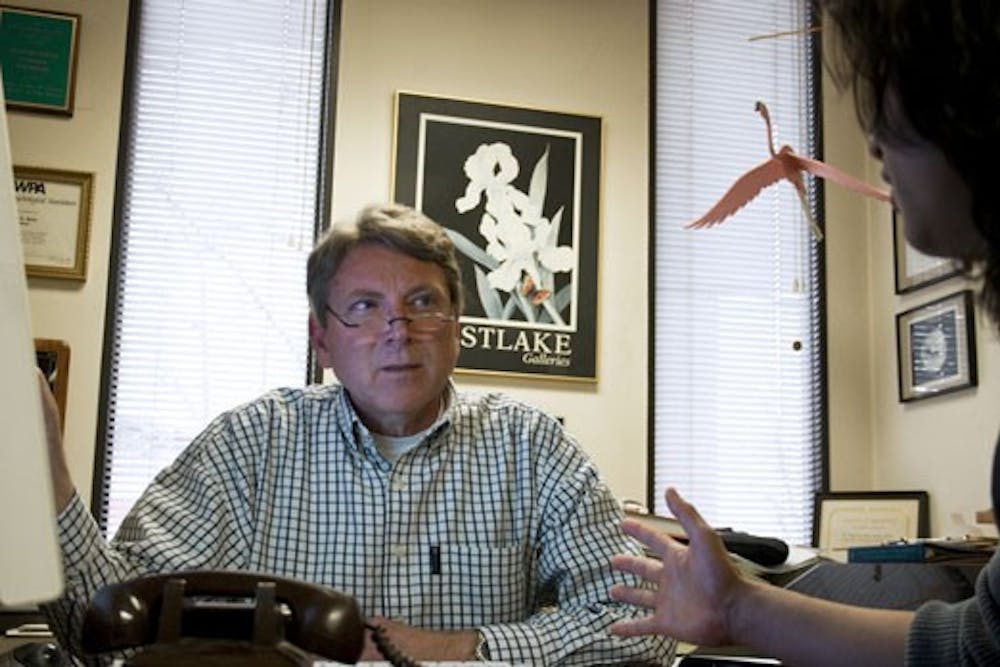 Professor Gordon Hodge meets with graduate assistant Masato Nakazawa during his office hours in Logan Hall on Wednesday. On RateMyProfessors.com, Hodge was rated lowest of all UNM professors. 