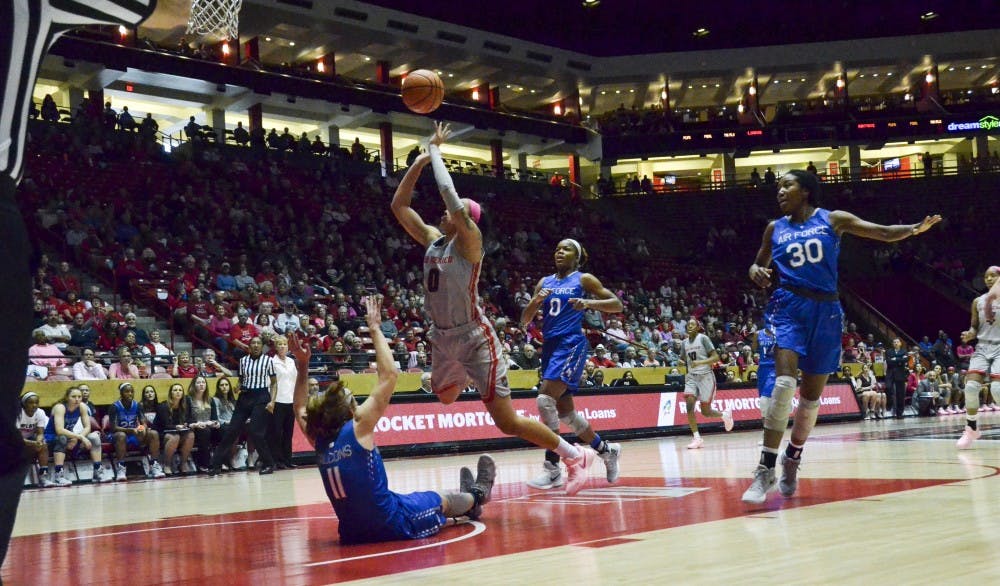 Starting University of New Mexico senior Cherise Baynon knocks down Air Force senior Cortney Porter as she goes in for the basket during the UNM vs. Air Force game on Jan. 10, 2018. UNM took the victory 57-49.