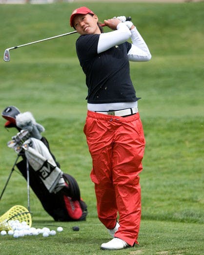 Britney Choy works on her swing Thursday during practice at the UNM Championship Golf Course. The UNM women's golf team will host the Mountain West Conference Tournament beginning April 17. 