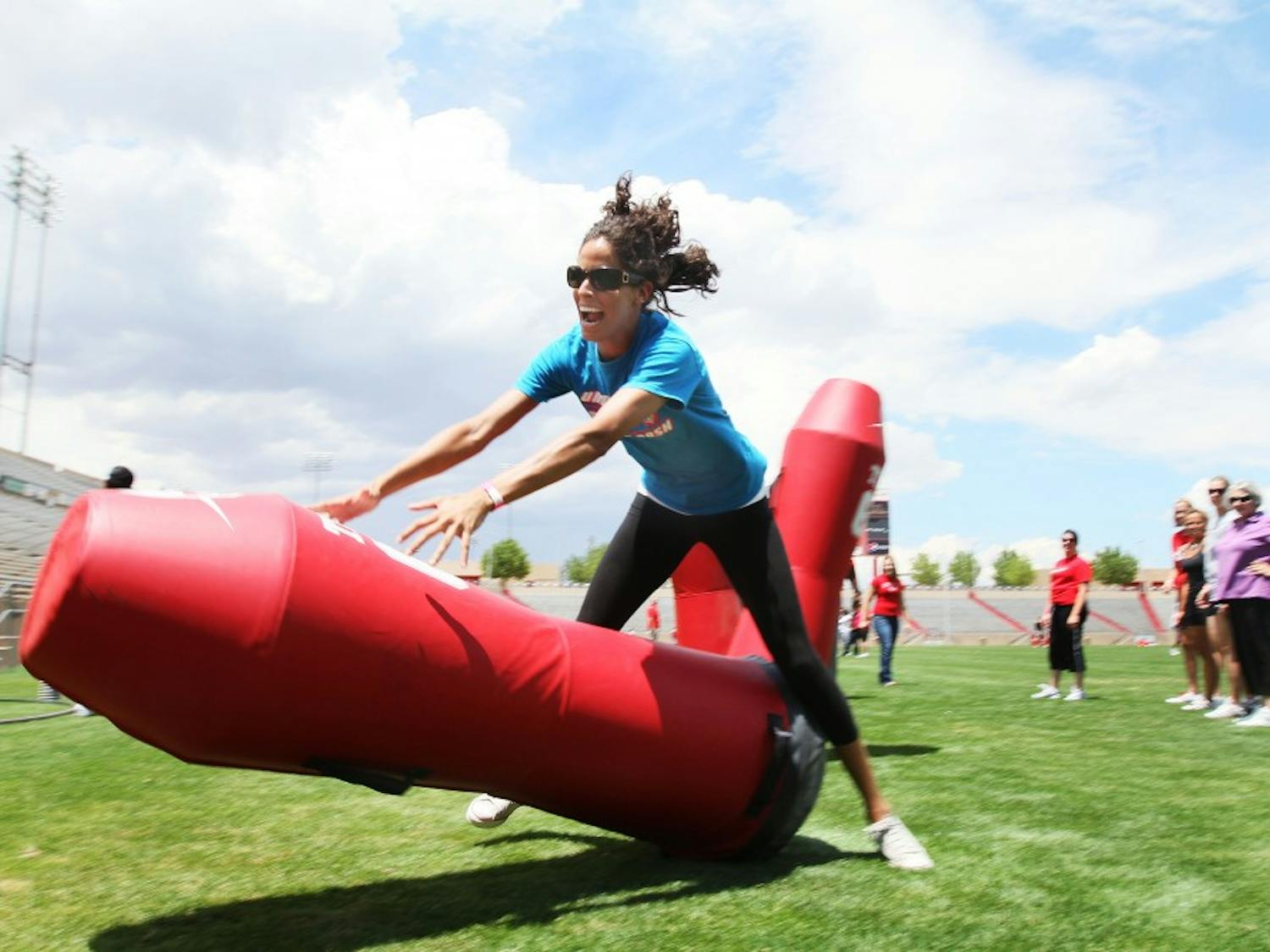 	Robin Miramontes runs through a drill at the women’s clinic on Saturday. The camp was put on by the UNM football program and run by quarterbacks coach David Reaves. 