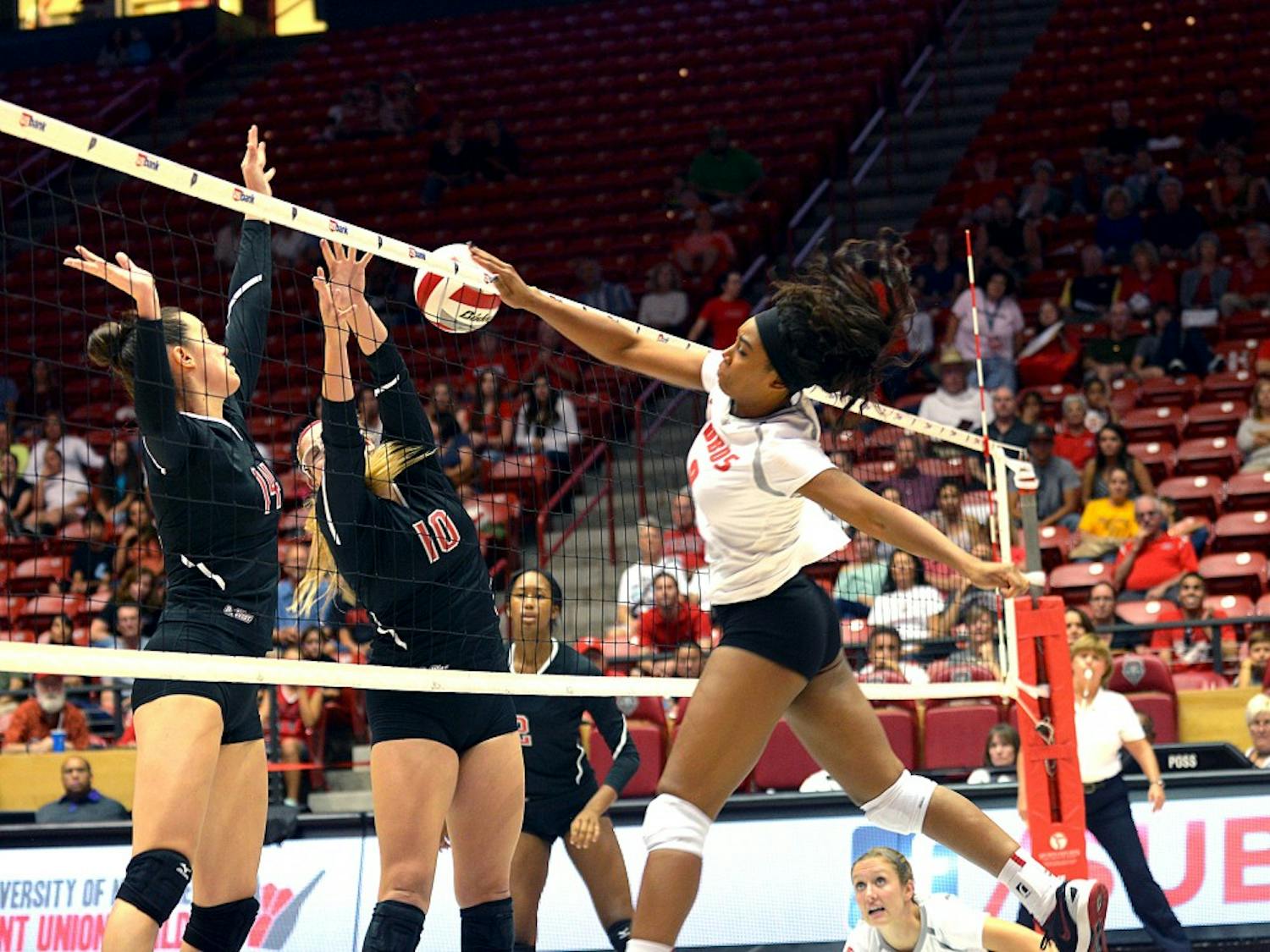 UNM middle blocker Simone Henderson spikes the ball at the Lobos game against Cal State Northridge on Friday evening at WisePies Arena. The Lobos won 3-1 against the Matadors. 