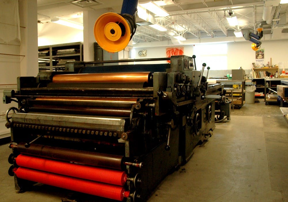 	An old German print machine sits idle at the Tamarind Institute located at the corner of Central Avenue and Stanford Drive. The Institute will soon celebrate its 50th anniversary at its state-of-the-art facility. 