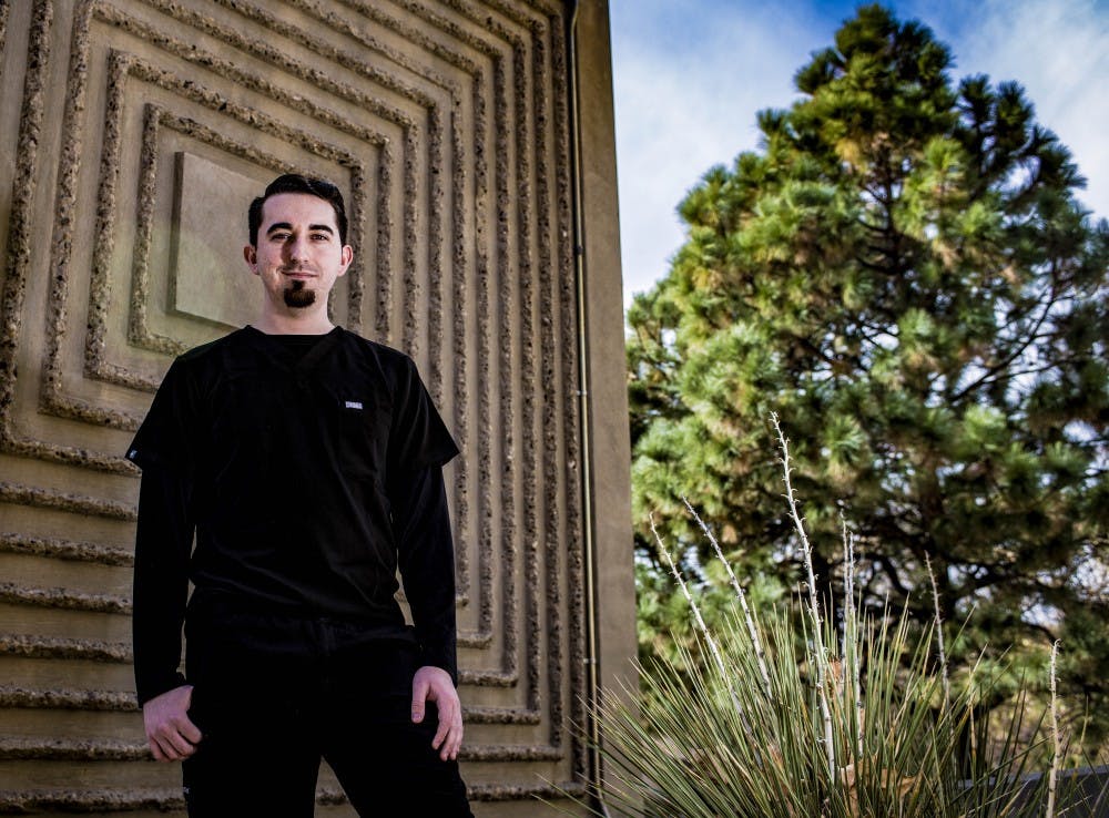 Nicholas Byres, RN, BSN, a graduate student of the UNM College of Nursing, stands near the College of Nursing and Pharmacy located on UNM's North Campus, Nov. 29, 2017.