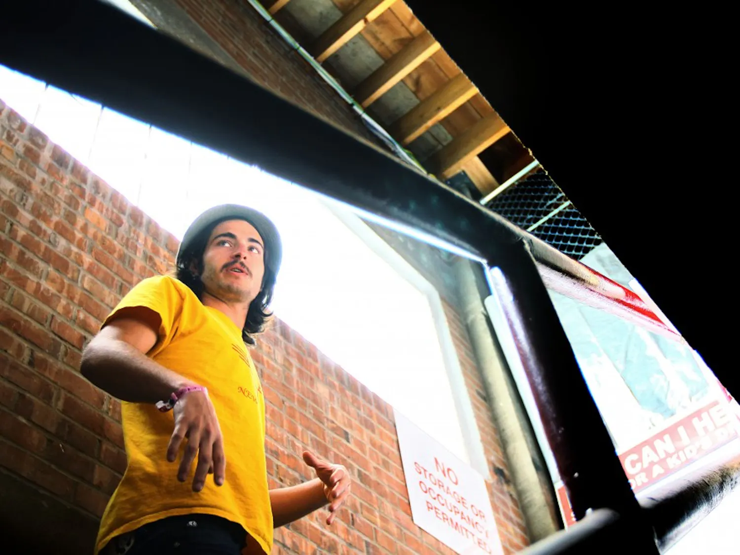 Dan Lewis walks upstairs from the lower half of the all-ages venue, Warehouse 508, on Monday. Lewis will be leaving the position as venue manager to pursue his career as a DJ.