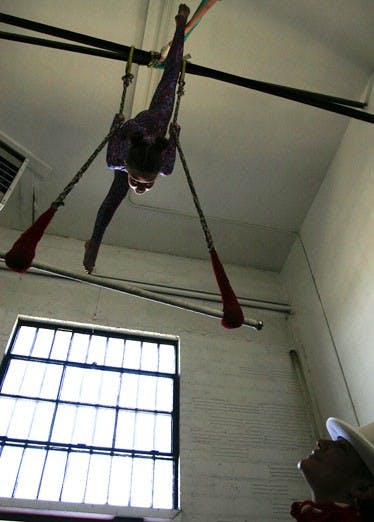 Rosalinda Rojas, right, watches Milan LissRede practice acrobatics at the Albuquerque Academy for Circus Arts, at 1001 Yale Blvd. S.E.