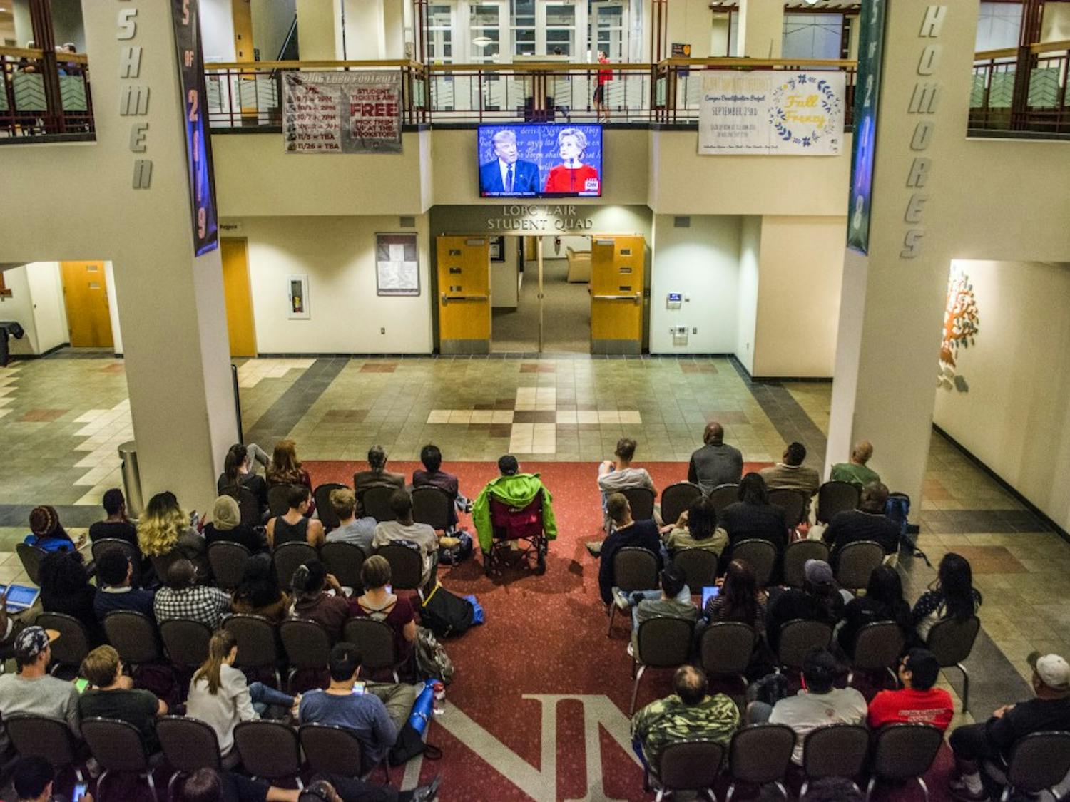 A crowd sits in front of a television in the SUB Atrium Monday Sept. 26, 2016 at UNMs Main Campus. Crowds gathered around various spots on campus to watch presidential candidates Donald Trump and Hillary Clinton in their first debate of this years presidential election. 