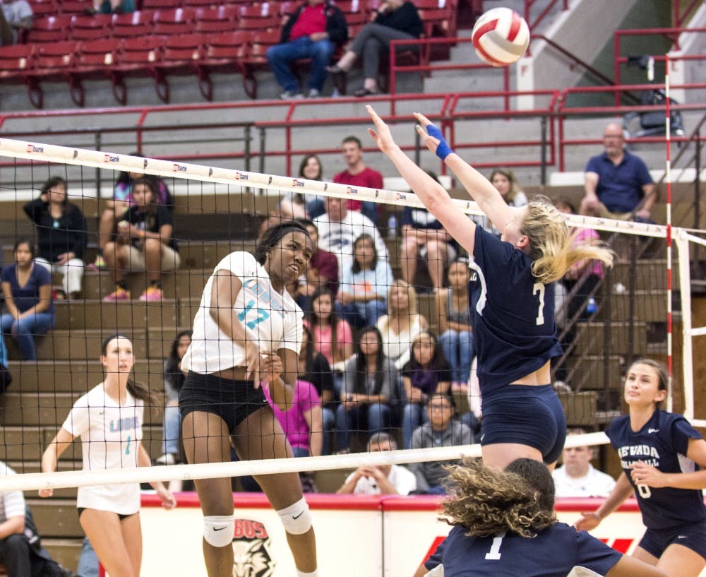 UNM middle blocker Skye Gullatt spikes the ball against Nevada on Sept. 26 at Johnson Center. The Lobos play Fresno State and UNLV this weekend.