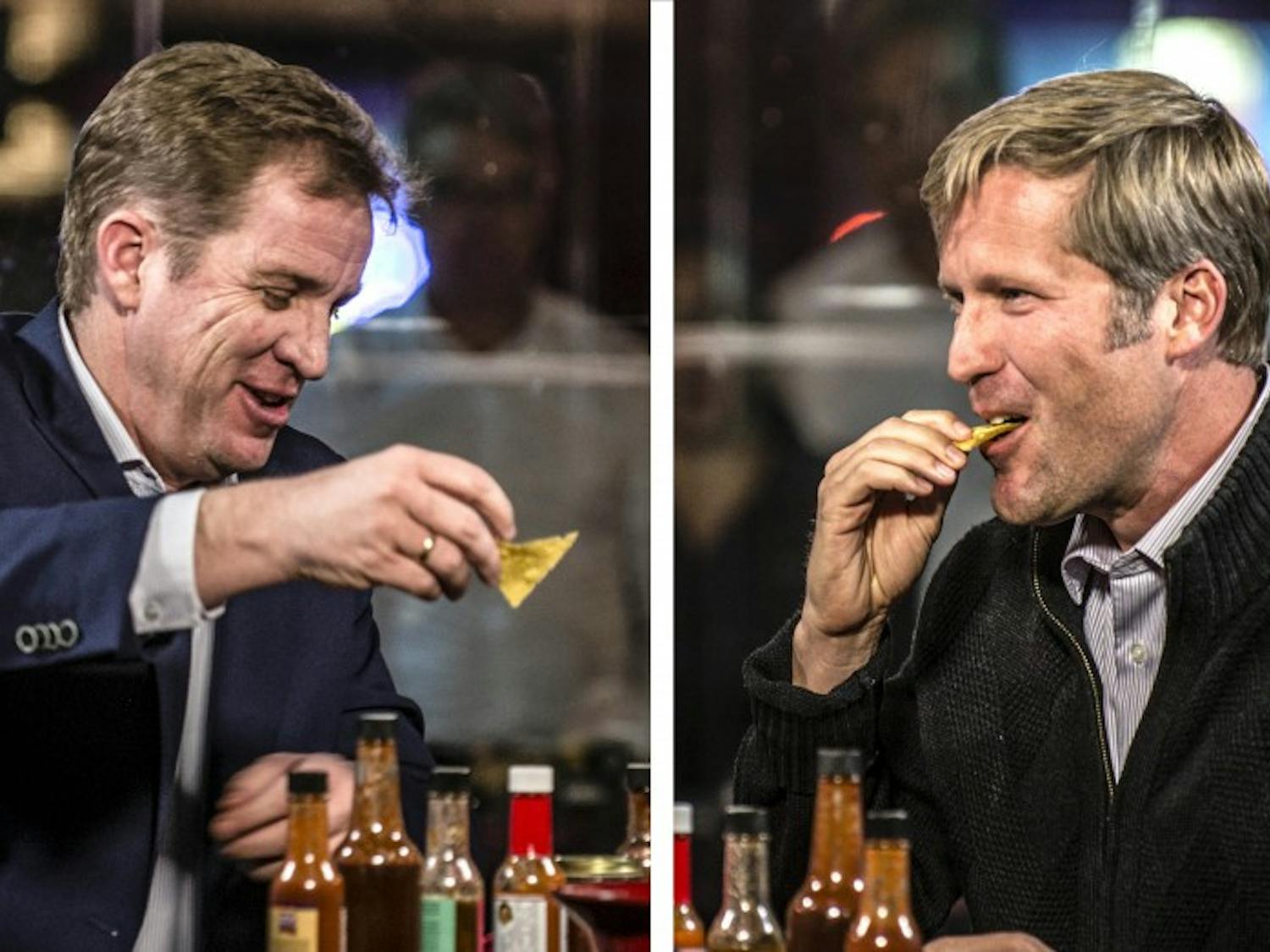 City Councilor Dan Lewis, left, and State Auditor Timothy Keller, right, participate in the Dukes Up Hot Seat interview series for the Albuquerque mayoral run-off election candidates on Oct. 25, 2017. Each interview consisted of the candidates eating nine different salsas/hot sauces, each hotter than the last, while also answering questions about their bid to become the city’s next mayor.