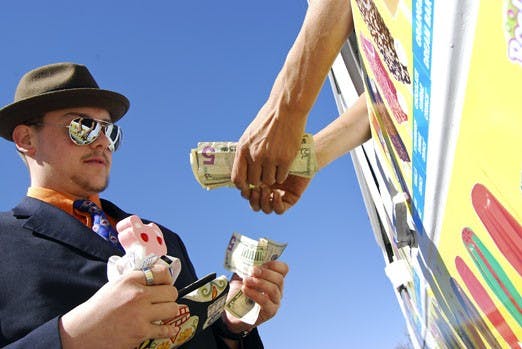 Zac Courtois buys ice cream from a vendor in front of Dane Smith Hall on Tuesday.