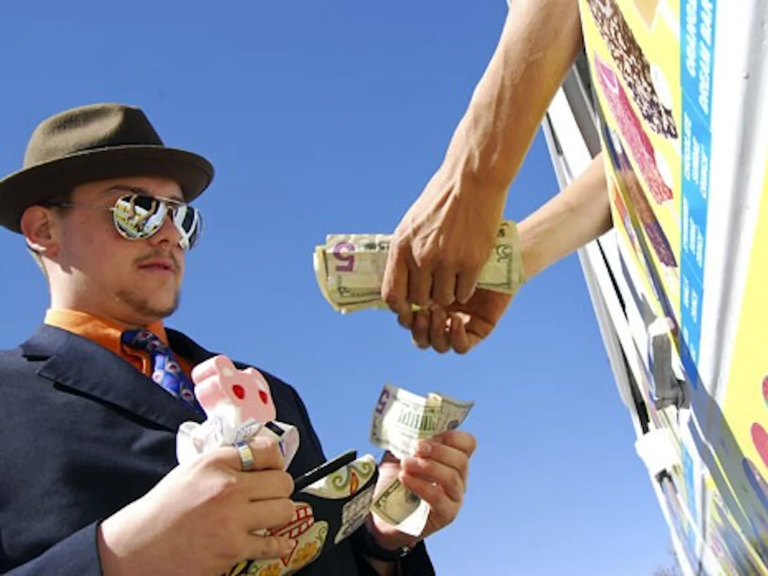 Zac Courtois buys ice cream from a vendor in front of Dane Smith Hall on Tuesday.
