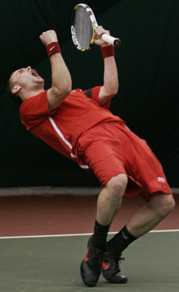 	Joe Wood celebrates after winning the Lobos’ double match on Saturday. UNM won 8 of 9
against Texas A&amp;M Corpus Christi.