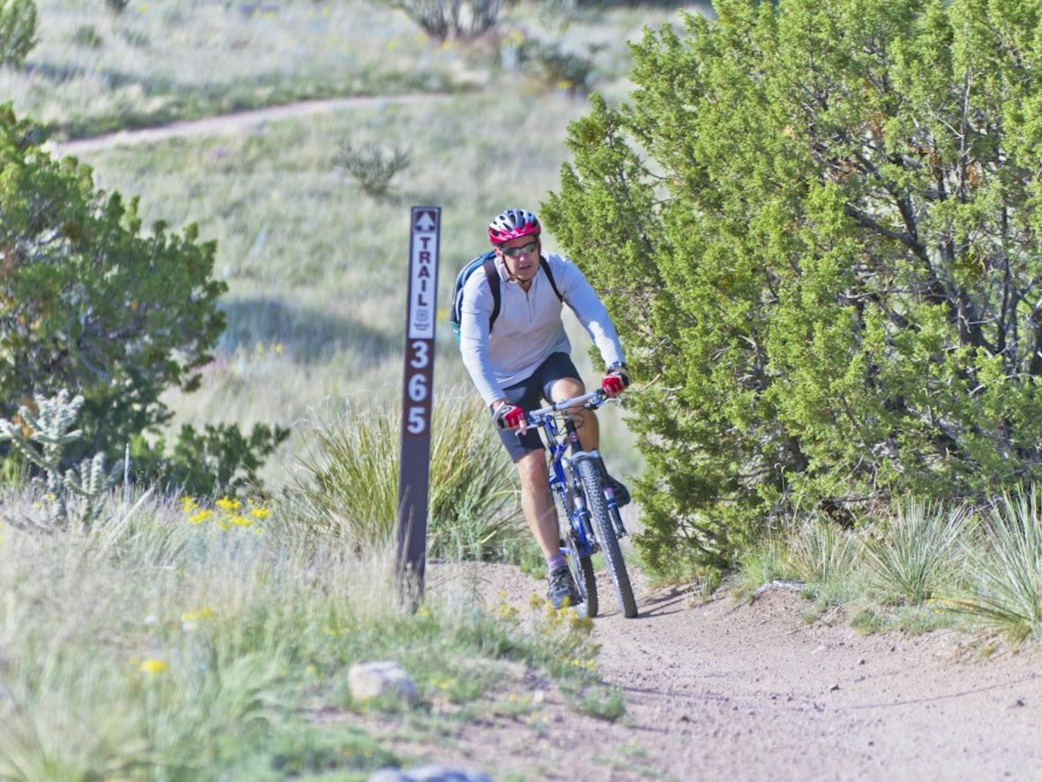 Michael Recker seen here riding the trails of Elena Gallegos recreation site in the Sandia Mountain foothills Saturday morning. Recker says this is amongst one of the top locations offered along the Sandia Mountains. Its location is close to the city and contains a very out of the city feel.