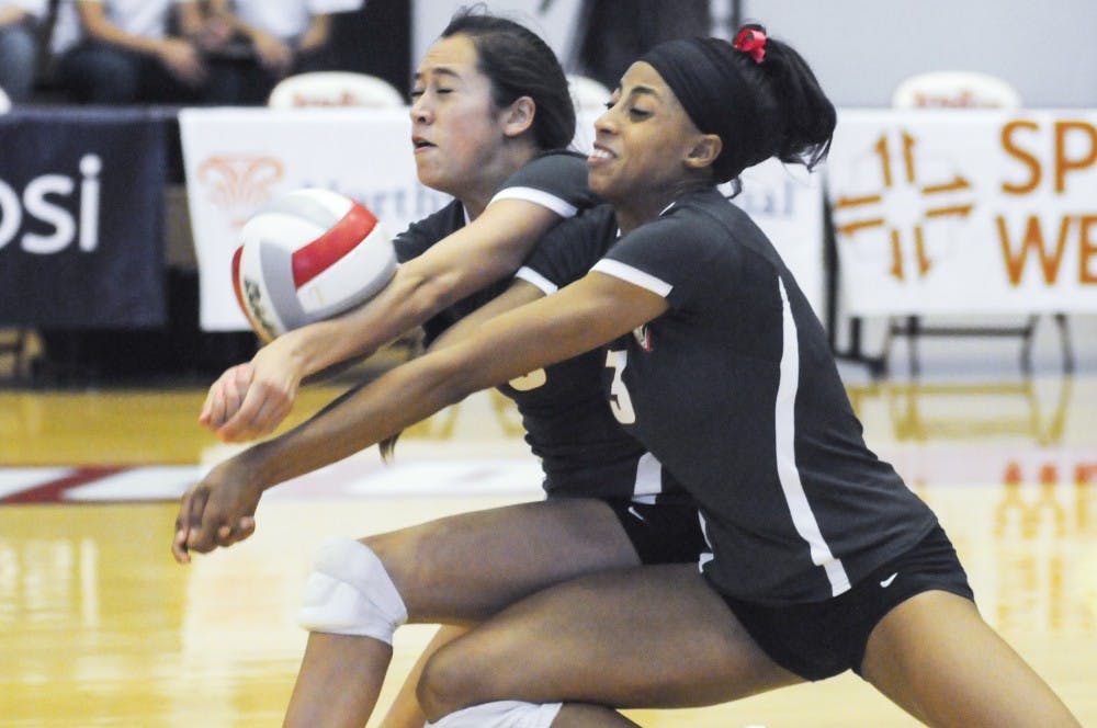 New Mexico right side hitter Chantale Riddle, 3, and outside hitter Eastyn Baleto bump the ball together back toward San Jose State’s side on Saturday at Johnson Gym. The Lobos’ next home game is on Nov. 6 at Johnson Gym against UNLV.