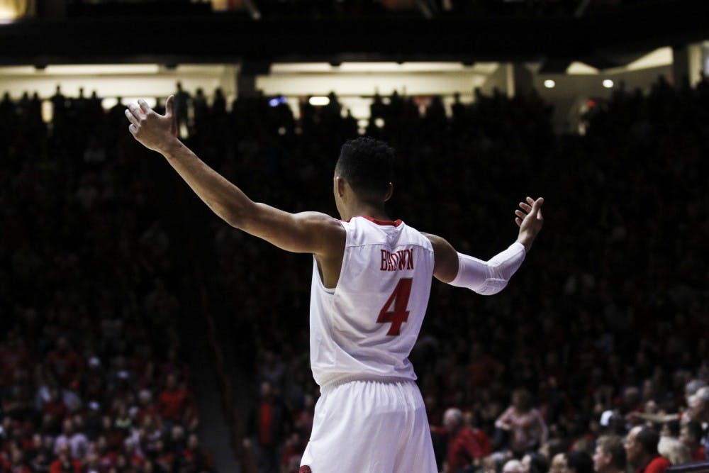 Junior guard Elijah Brown looks to the crowd with his hands in the air during the Lobos’ game against San Diego State University on Saturday, March 4, 2017 at WisePies Arena. The Lobos ended their last conference game with a victory against SDSU and will now head to Las Vegas, Nevada for the Mountain West Tournament.