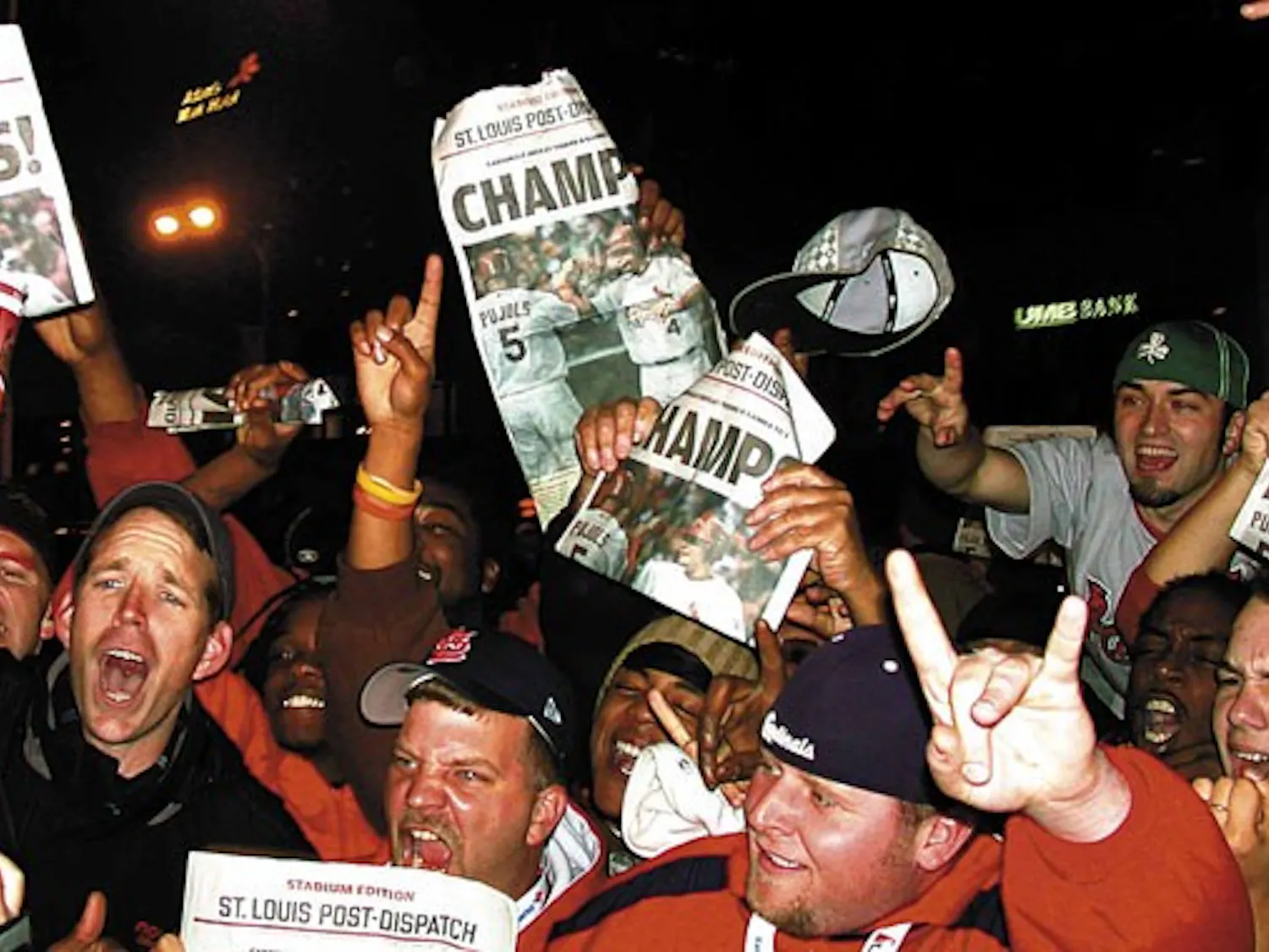 Fans of the St. Louis Cardinals revel in downtown St. Louis after the team wins the World Series on Friday.