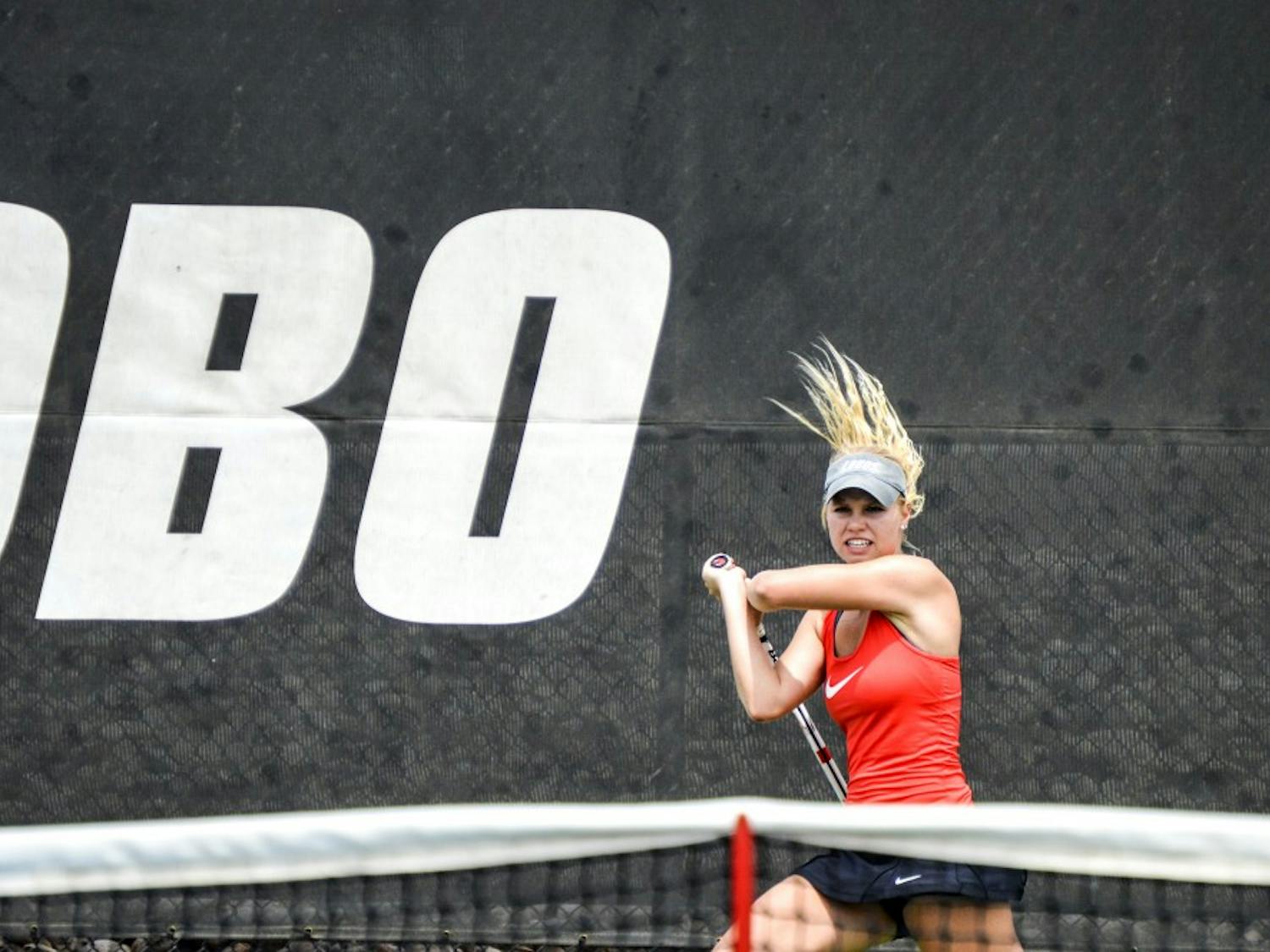 Junior Dominique Dulski swats the ball back to an Air Force player Saturday afternoon at the McKinnon Family tennis Stadium. The Lobos beat Air Force 6-1.