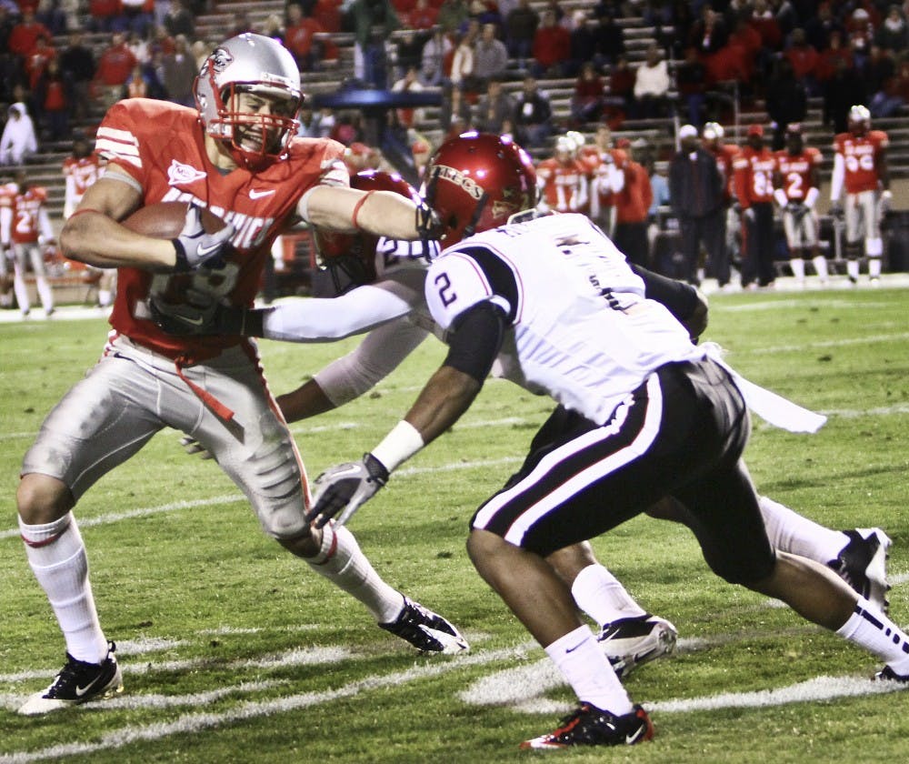 	Wide receiver Chris Hernandez evades San Diego State cornerbacks Leon McFadden, No. 2, and Nate Berhe during Saturday’s 30-20 loss. The Lobos, 0-7 overall, travel to Colorado State on Saturday.