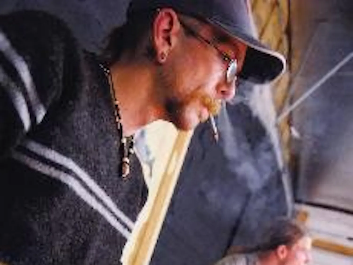 Instrument maker and musician Mike Rose, left, plays his homemade slide guitar while Mitchell Owen plays drums during a practice Tuesday at The Curio.