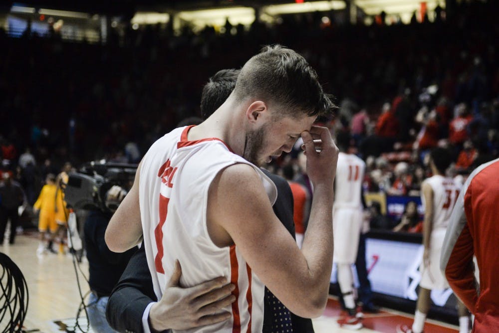 Redshirt sophomore guard Cullen Neal is walked off the court by Lobo&nbsp;strength and conditioning coach Jeremy Anderson&nbsp;Saturday, Jan. 16, 2015 at WisePies Arena. Neal received a concussion&nbsp;on the last play against Wyoming and has been ruled out for the upcoming game at San Jose State, head coach Craig Neal announced Thursday.