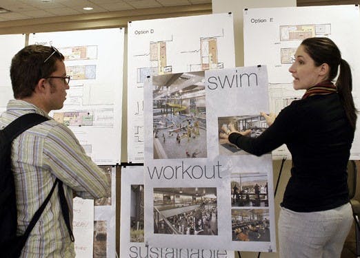 ASUNM President Ashley Fate explains plans to build a recreational center in the SUB to student Wolf Scott-Cohen.