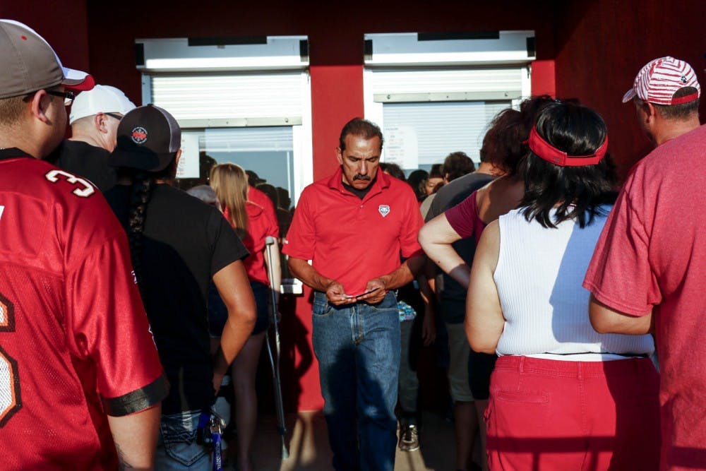 David Gonzales counts his tickets before the UNM football game against Abilene Christian University on Sept. 2, 2017. For this upcoming season UNM sports tickets will be sold at a lower price. 