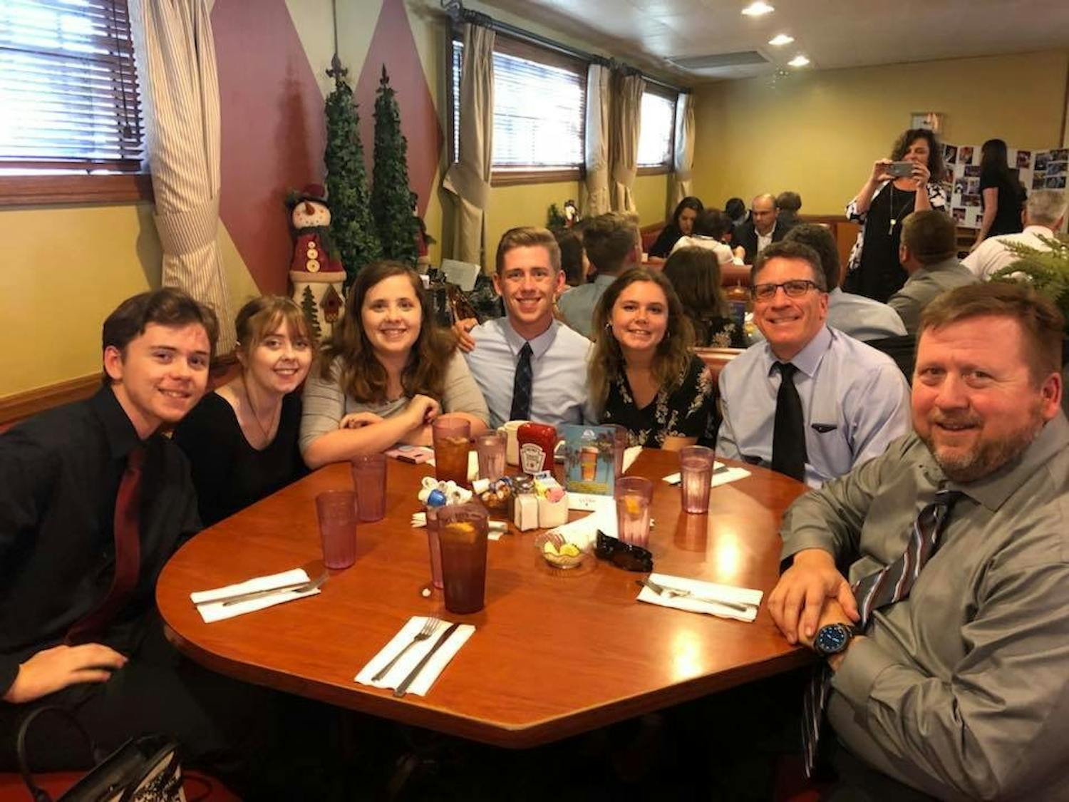 Kyle Land (center) and his family at The Talleyrand Restaurant in Burbank, C.A. after his grandfather's funeral. Courtesy of the Land family.