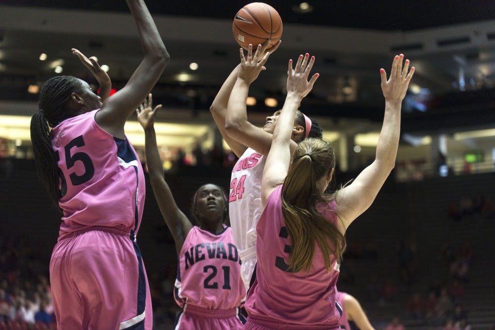 New Mexico guard Jayda Bovero shoots over Nevada defenders during Saturdays game at WisePies Arena. The Lobos defeated the Wolf Pack 63-45.