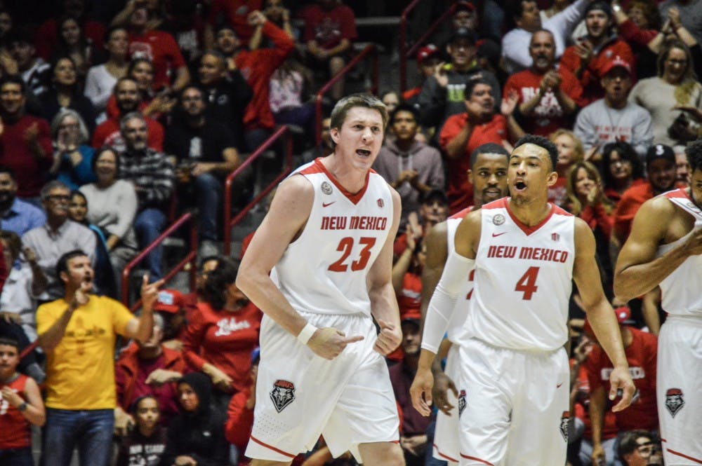 Junior forward Joe Furstinger, right, celebrates with teammates during the Lobos games against the New Mexico State Aggies Friday, Nov. 17, 2016 at WisePies Arena. The Lobos beat the Aggies in their 2016 Rio Grand Rivalry game 72-59.