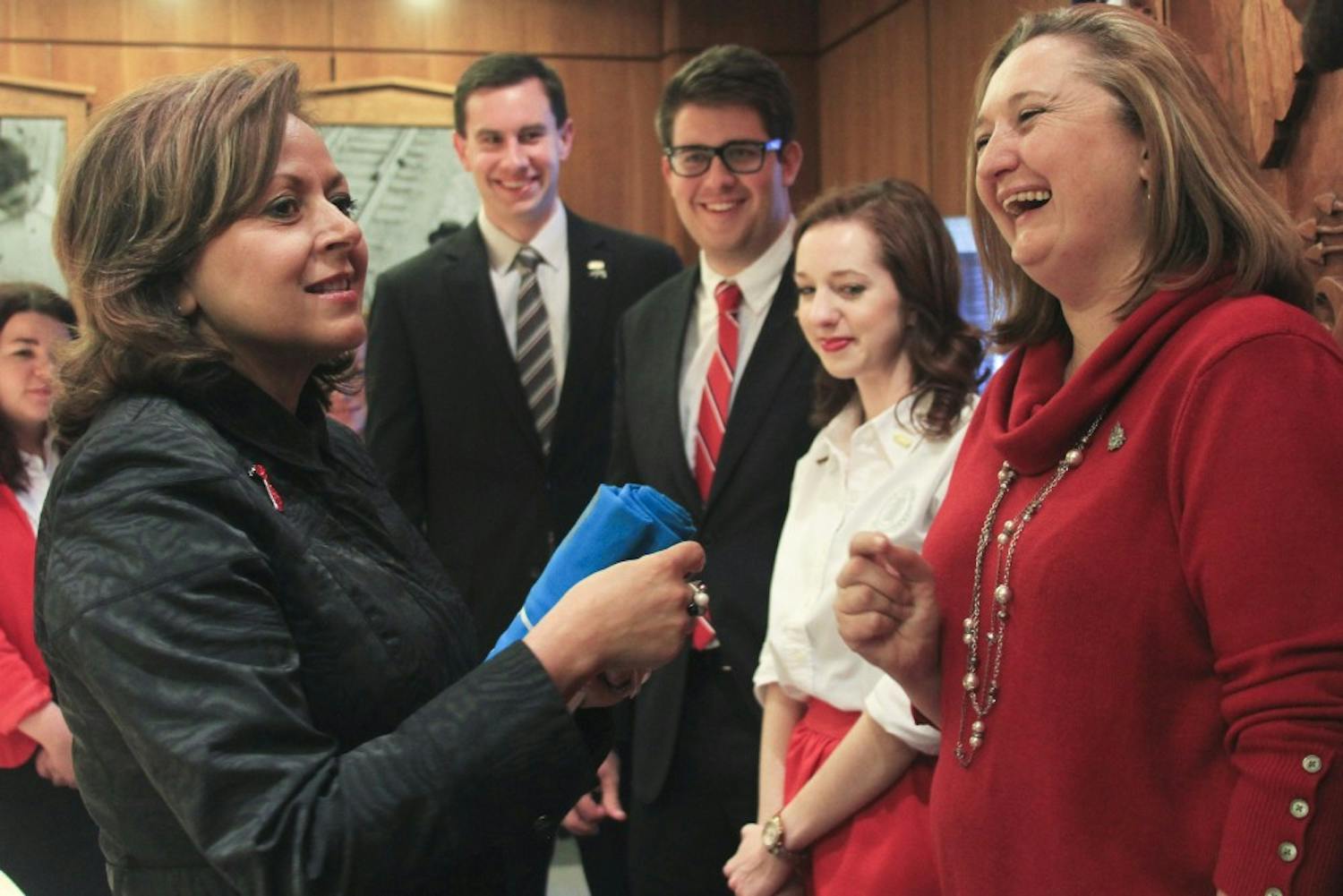 Gov. Susana Martinez greets GPSA President Texanna Martin, right, Rachel Williams and other student government representatives at the State Capitol building in Santa Fe. Monday marked UNM Day at the state Legislature.