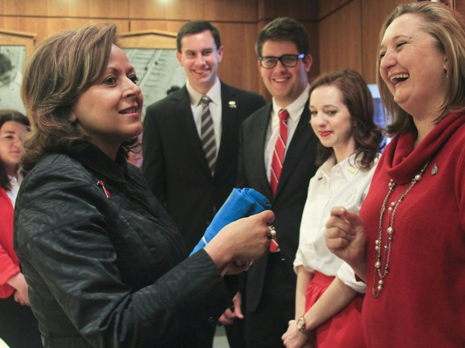 Gov. Susana Martinez greets GPSA President Texanna Martin, right, Rachel Williams and other student government representatives at the State Capitol building in Santa Fe. Monday marked UNM Day at the state Legislature.