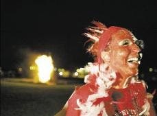 Wellsley Loyd shows her support for the Lobos during Red Rally at Johnson Field on Thursday.