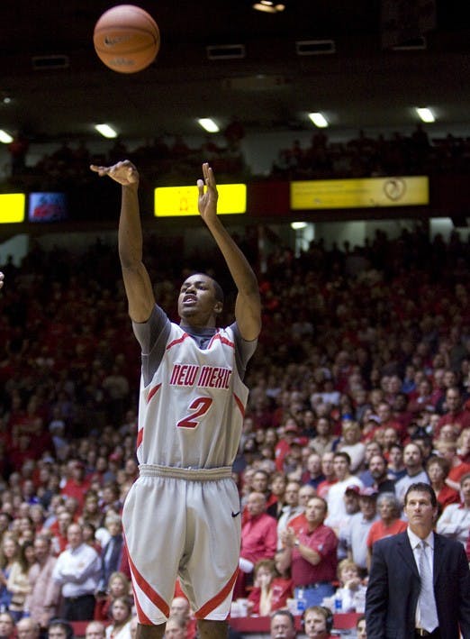 UNM guard Jonathan Wills attempts a 3-pointer early in the second half against TCU Saturday at The Pit. The Lobos won 64-48.