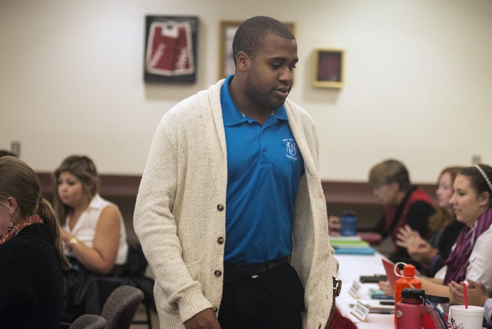Jordan Monroe walks through the ASUNM meeting that was held Nov. 4 in the SUB Lobo A&B room. Monroe resigned from the Communication Director position and ASUNM will be looking for a replacement.&nbsp;