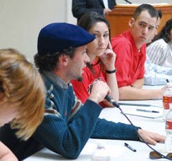 Vice presidential candidate Sebastian Pais Iriart answers a question from the audience while presidential candidate Ashley Fate and vice presidential candidate Matt Barnes listen during the ASUNM debate in the SUB Atrium on Tuesday. 